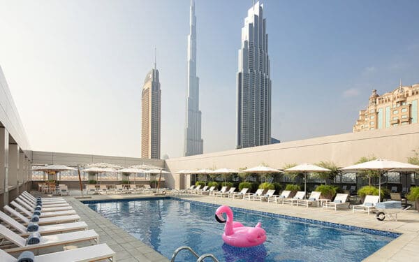 Rove Downtown Hotel swimming pool with a view of Dubai skyline